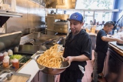 Raul Estrella makes fries at Square Pie Guys on Thursday, Dec. 5, 2019 in San Francisco, Calif. Square Pie Guys is a new Detroit-style pizza shop in SoMa owned by Marc Schechter and Danny Stoller.